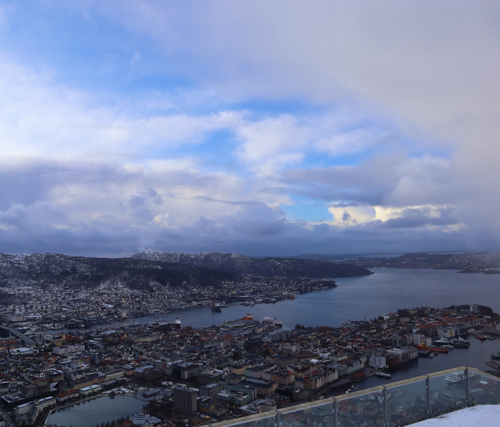 Bergen from Fløyen: the harbor, red roofs, and mountains along the fjord